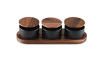 Load image into Gallery viewer, Black Ceramic Condiment Set on Acacia Wood Base
